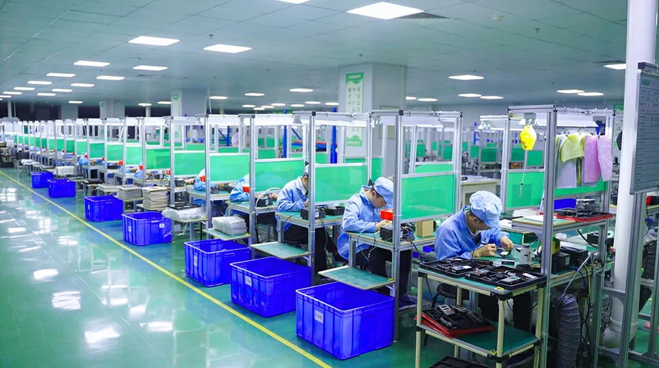 LinkPCBA technicians assembling finished electronic products at box build workstations