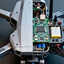 IoT drone device showing external housing and internal PCB layout