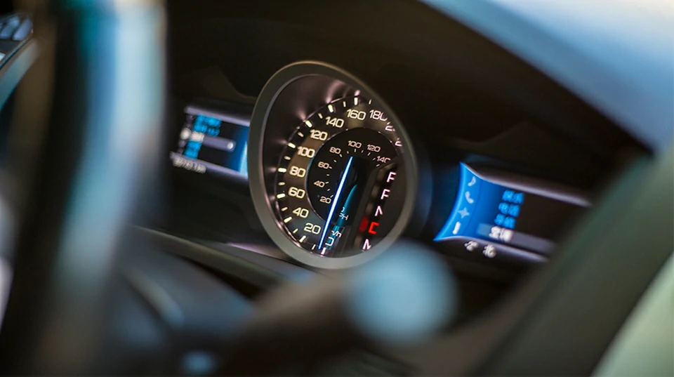 Automotive dashboard electronics system showing real-time vehicle data display